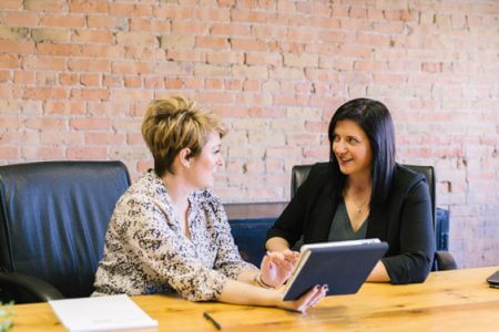 Two women collaborating